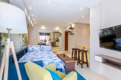 a bedroom with a bed and a living room at Le Palmier - Appartement Authentique à Gueliz in Marrakech