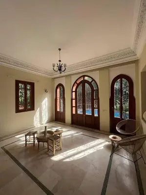 a large room with a table and chairs in it at The Majestic Marrakesh Villa 16 in Marrakech