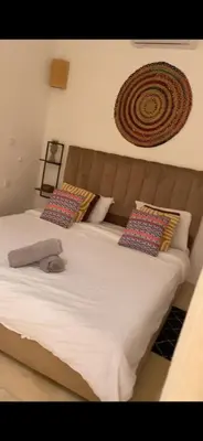 a large white bed with two pillows on it at Riad Laila Marrakech in Marrakech