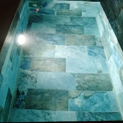 a tile floor with a light on top of it at Riad Laila Marrakech in Marrakech