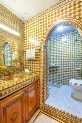 a bathroom with a shower and a sink and a toilet at Luxury Appartement gueliz center in Marrakech