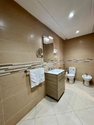 a bathroom with a sink and a toilet at Charmant Appartement au Cœur de la Ville in Marrakech