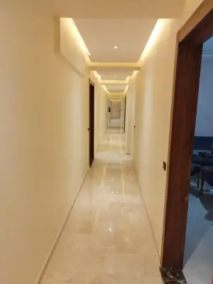 a long hallway with a view of the ocean at Luxury Apartment Marrakesh in Marrakech