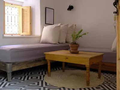 a living room with a couch and a table at Dar Oki in Marrakech