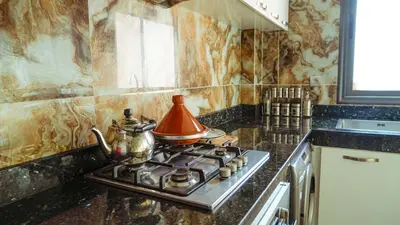 a tea kettle sitting on top of a stove in a kitchen at Apartment in Marrakech in Marrakech