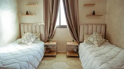 a bedroom with two beds and a window at Apartment in Marrakech in Marrakech