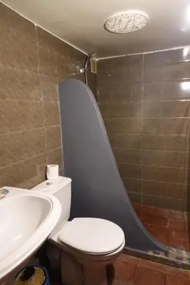 a bathroom with a toilet and a sink and a shower at Dar Suncial in Marrakech