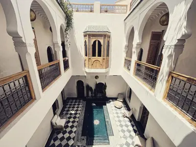 an aerial view of a house with a swimming pool at Riad LallaBaya in Marrakech