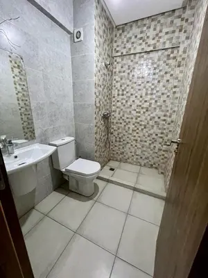 a bathroom with a toilet and a sink at appartement 2chambres salon Nour8 in Marrakech