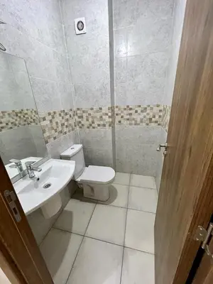 a bathroom with a toilet and a sink at appartement 2chambres salon Nour8 in Marrakech