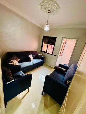 a living room with a couch and two couches at Superbe Appartement proche centre marrakech, neuf tout équipé in Marrakech