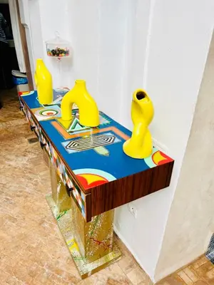 a table with yellow vases on top of it at Riad Darna 4 chambres avec piscine et petit déjeuner in Marrakech