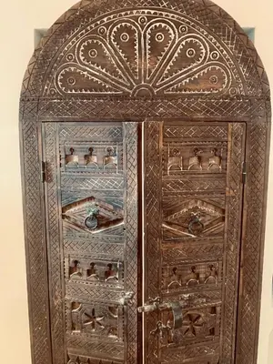 an old wooden cabinet with its doors open at Riad Darna 4 chambres avec piscine et petit déjeuner in Marrakech