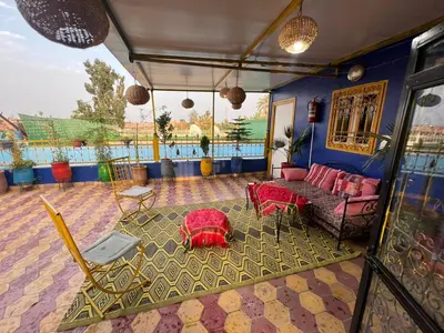a living room with a couch and a table at Riad dar sahrawi in Marrakech