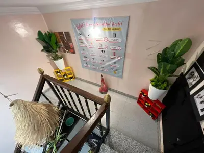 a room with plants and a board on the wall at Riad dar sahrawi in Marrakech
