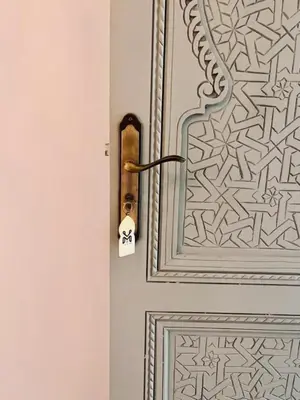 a door with a lock on it with a pattern on it at Riad M17 & Spa - Médina in Marrakech