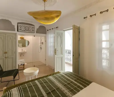 a bedroom with a bed and a yellow ceiling at Riad M17 & Spa - Médina in Marrakech