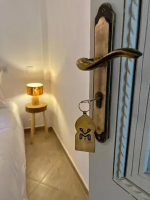 a room with a bed and a door with a lock at Riad M17 & Spa - Médina in Marrakech