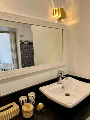 a bathroom with a sink and a mirror at Riad M17 & Spa - Médina in Marrakech