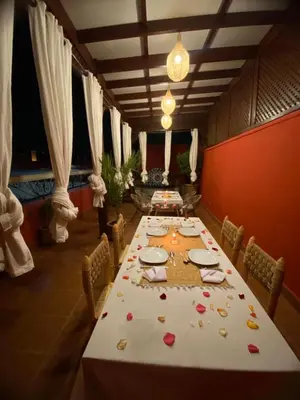 a dining room with a long table with hearts on it at Riad La Bigarade in Marrakech