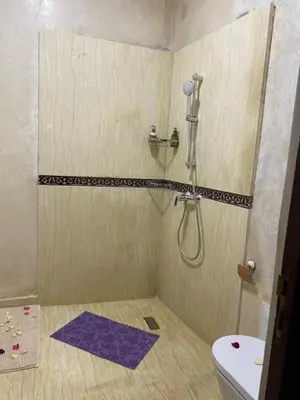 a bathroom with a shower and a toilet at Riad La Bigarade in Marrakech