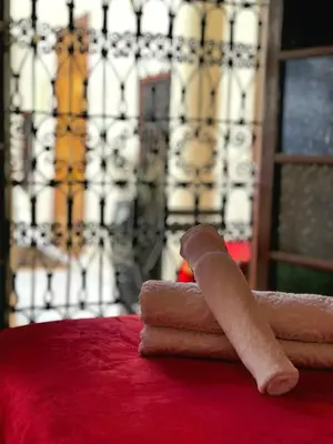 a stack of towels sitting on top of a table at Riad La Bigarade in Marrakech