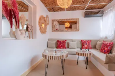 a living room with a couch and two tables at Rooftop centre ville Marrakech in Marrakech