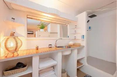 a bathroom with a sink and a mirror at Rooftop centre ville Marrakech in Marrakech