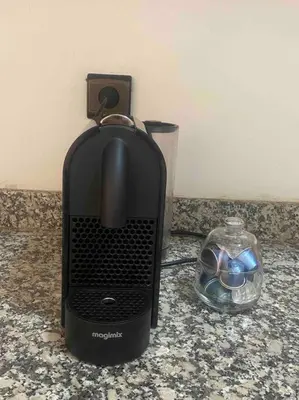 a black heater on a counter next to a glass bowl at Glamorous Marrakech in Marrakech