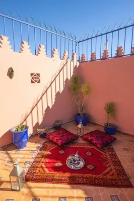 a room with a staircase with a rug on the floor at La lune de Marrakech Riad in Marrakech