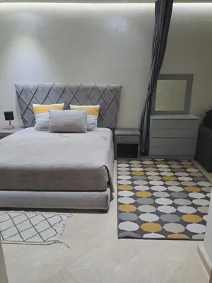 a bedroom with a bed and a rug at Chez Dar safaa in Marrakech