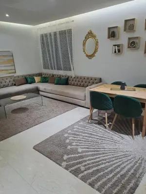 a living room with a couch and a table at Chez Dar safaa in Marrakech