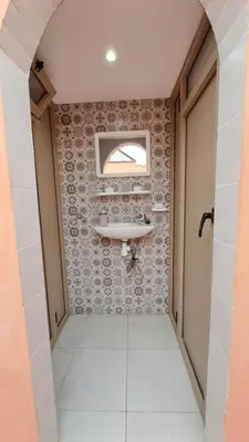 a bathroom with a sink and a mirror at Riad Anisse in Marrakech
