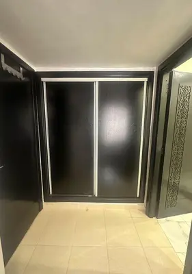 a sliding glass door in a room with a tile floor at Appartement agréable en plein coeur de Marrakech pour 2 à 4 Personnes in Marrakech
