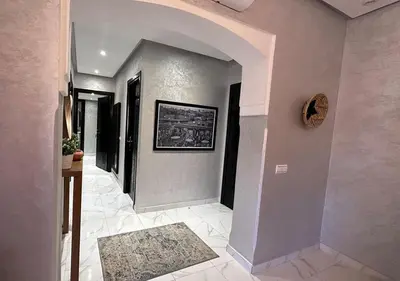 a hallway of a house with an archway at Appartement agréable en plein coeur de Marrakech pour 2 à 4 Personnes in Marrakech