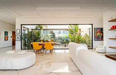 a living room with a white couch and a table at Manzal Vista in Marrakech