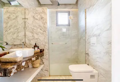 a bathroom with a shower and a toilet and a sink at Manzal Vista in Marrakech