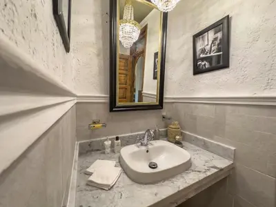 a bathroom with a sink and a mirror at Maison Maria Palmeraie in Marrakech