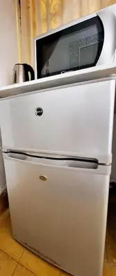 a white refrigerator with a microwave on top of it at STUDIO LOFT MEDINA AVEC TERRASSE in Marrakech