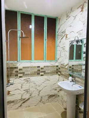 a bathroom with a sink and a mirror at Maison Cascada in Marrakech