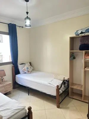 a bedroom with two beds in a room at Charming Room Near Marrakech Airport in Marrakech