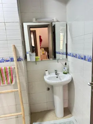a bathroom with a sink and a mirror at Charming Room Near Marrakech Airport in Marrakech