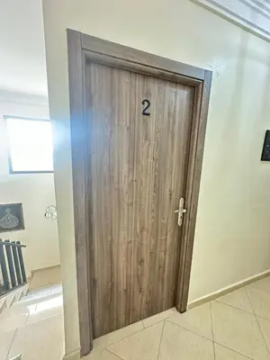 a wooden door with the number two on it at Charming Room Near Marrakech Airport in Marrakech