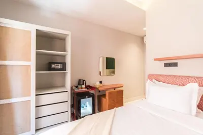 a bedroom with a bed and a desk at JEMAA EL FNA Suites & Spa in Marrakech