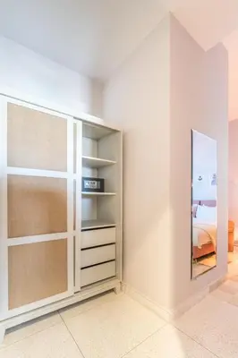 a bedroom with a closet with a mirror at JEMAA EL FNA Suites & Spa in Marrakech
