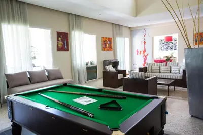 a living room with a pool table at Villa Loanaelle in Marrakech