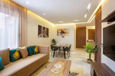 a living room with a couch and a table at Luxury apartment in center Of Marrakech City in Marrakech