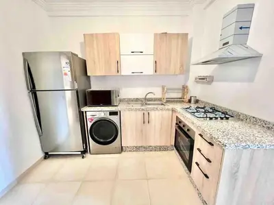 a kitchen with a stainless steel refrigerator and a dishwasher at Cozy&Elegant apartment/pool/city center/Gueliz in Marrakech