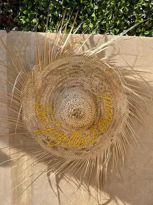 a straw hat sitting on top of a wall at Riad Les Gazelles D'Orient Marrakech in Marrakech