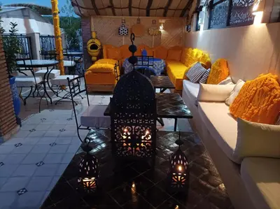 a living room with a couch and a table at Riad Les Gazelles D'Orient Marrakech in Marrakech